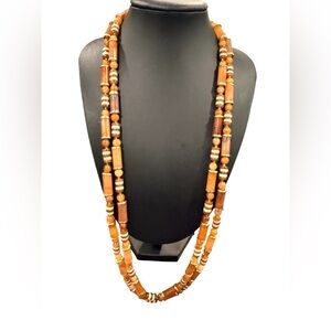 long beaded necklace made of petrified wood.tiger eye style from 1970’s